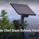 Fostoria News Toledo police camera and solar panel fence with Free Press logo.